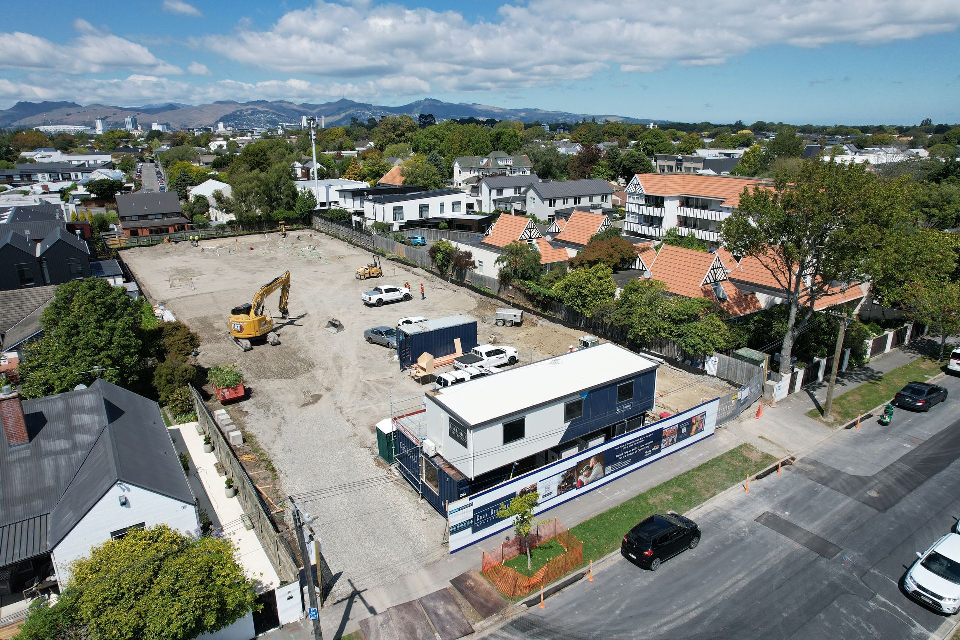 An empty building site just starting in a semi residential area