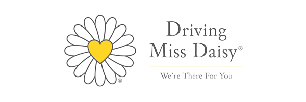 A logo for driving miss daisy with a daisy and a heart