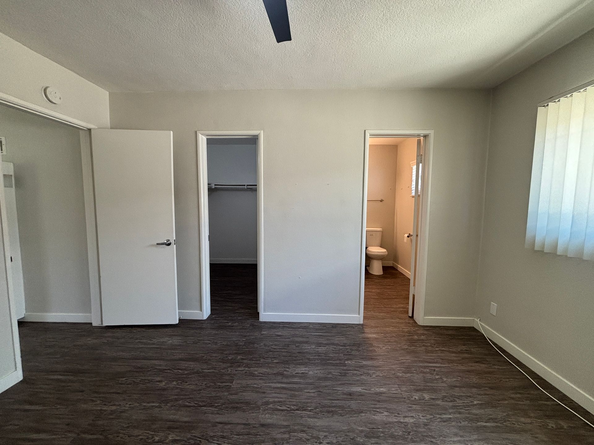 Living room area, showing a bathroom in the background