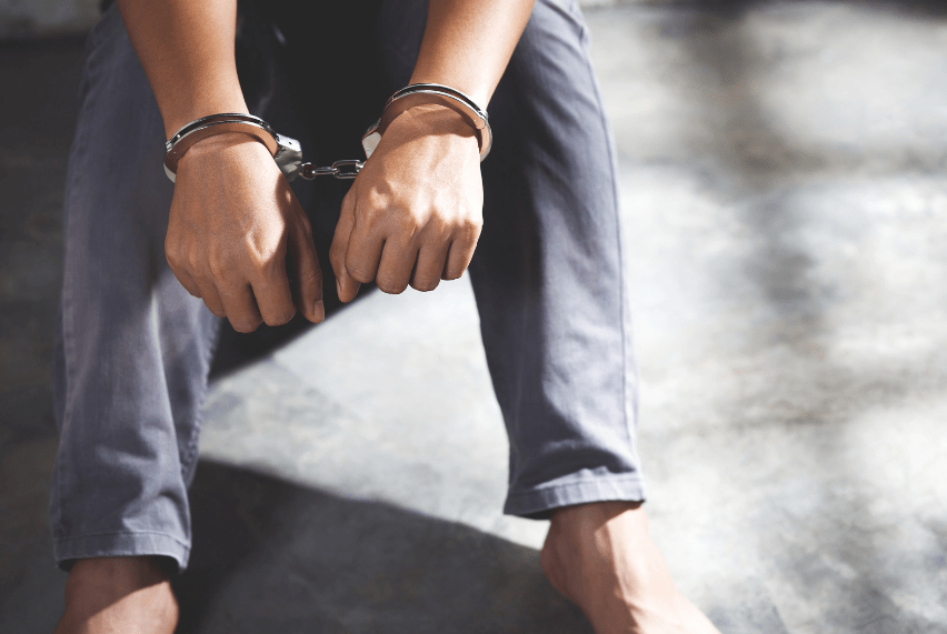 Man in handcuffs.