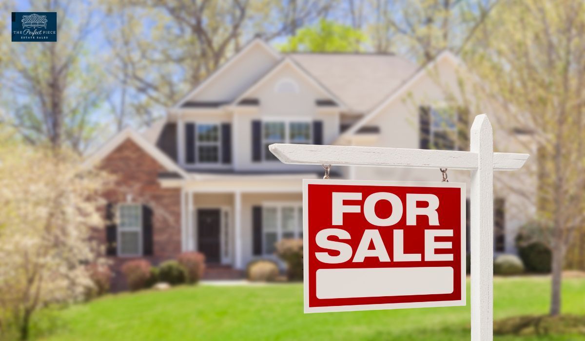 A house with a for sale sign in front of it