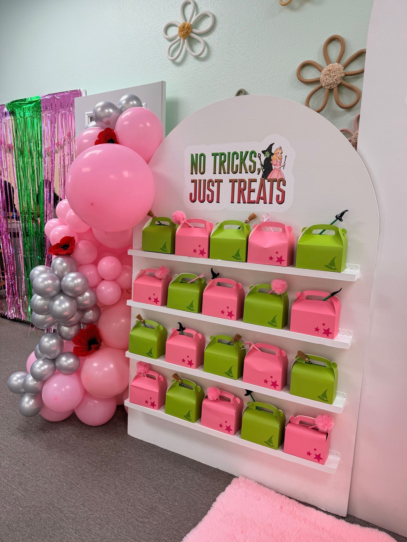 Pink and green dessert display with gift boxes, balloons, and “My Treats Just Treats” sign