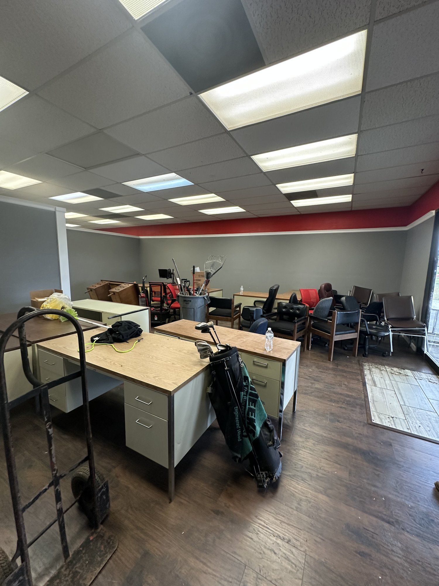 Office furniture and desks before a commercial office cleanout