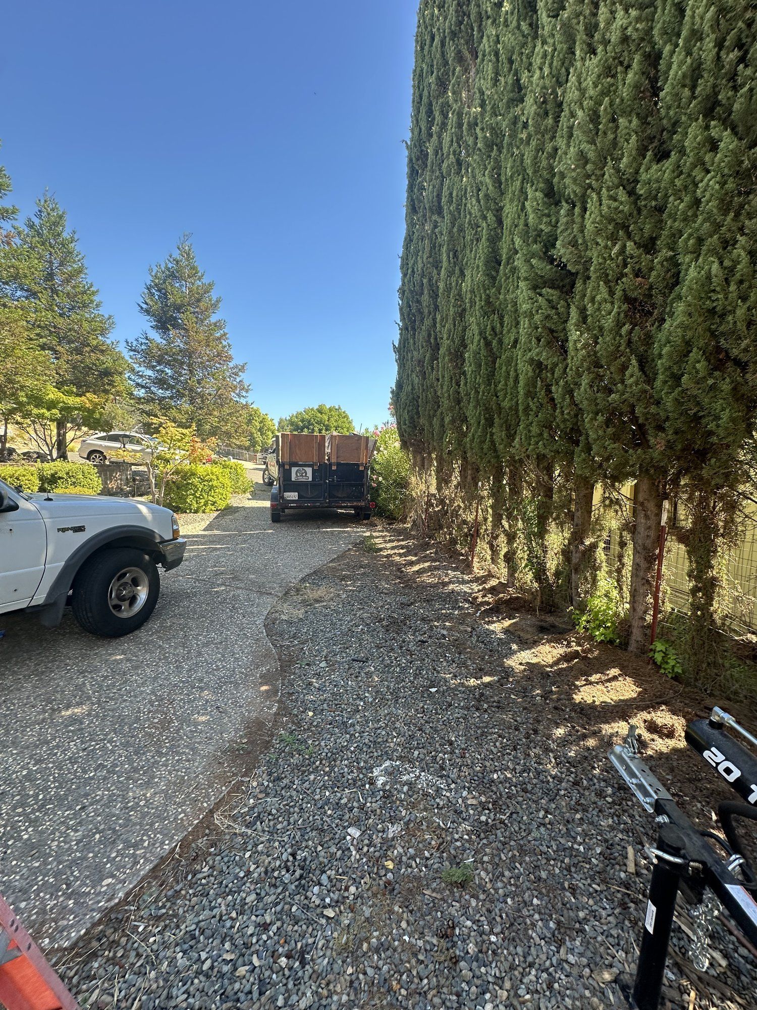 Cleared gravel driveway after junk haul away in Butte County