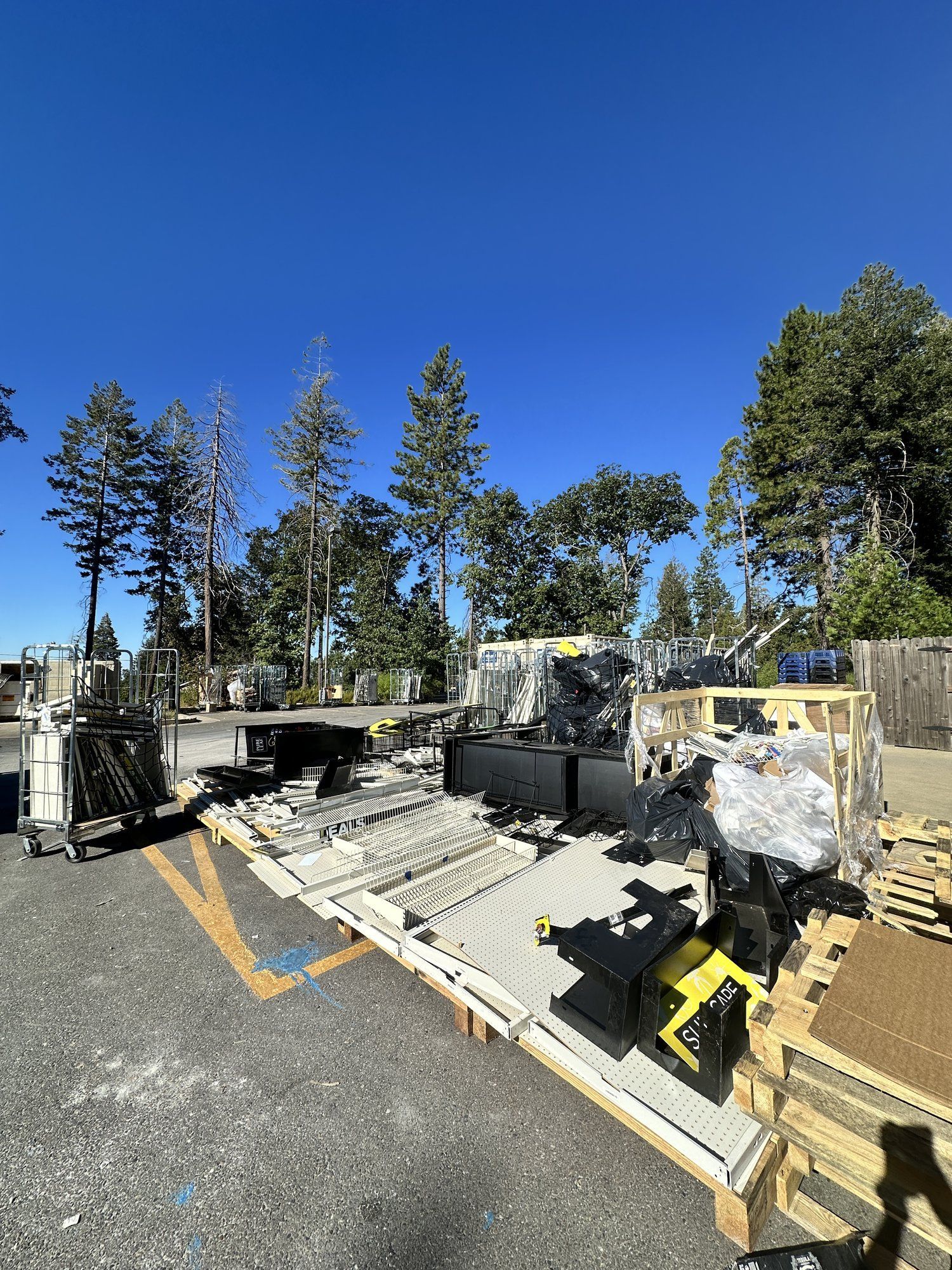 Loaded LJ Junk Away trailer with construction debris and lumber