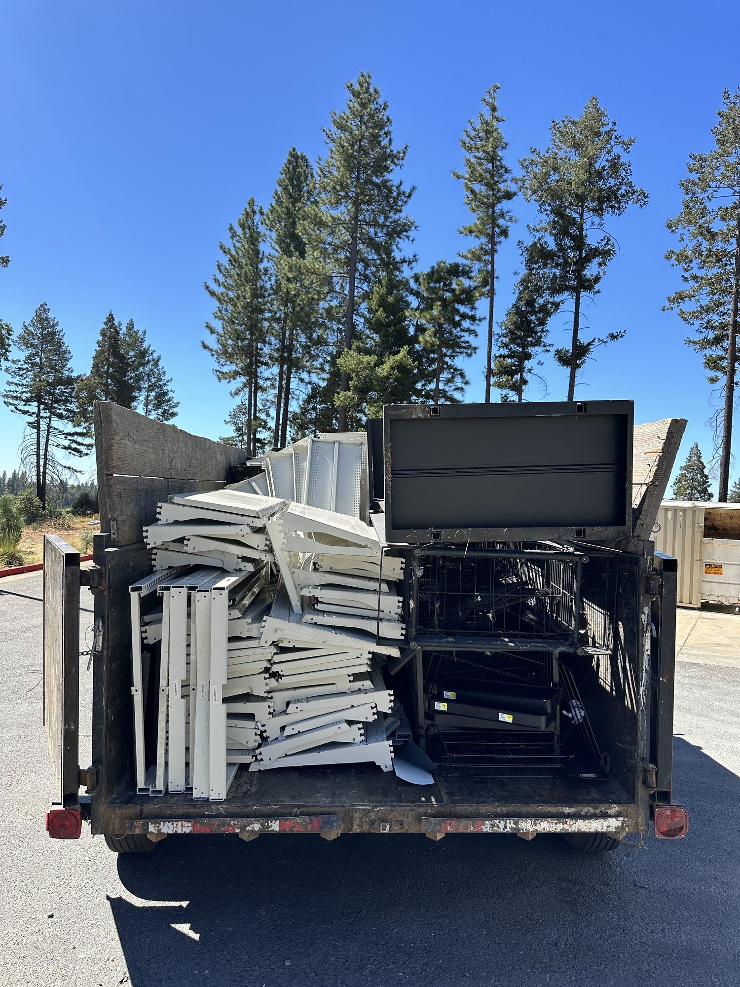 LJ Junk Away trailer fully loaded with junk and debris for haul away