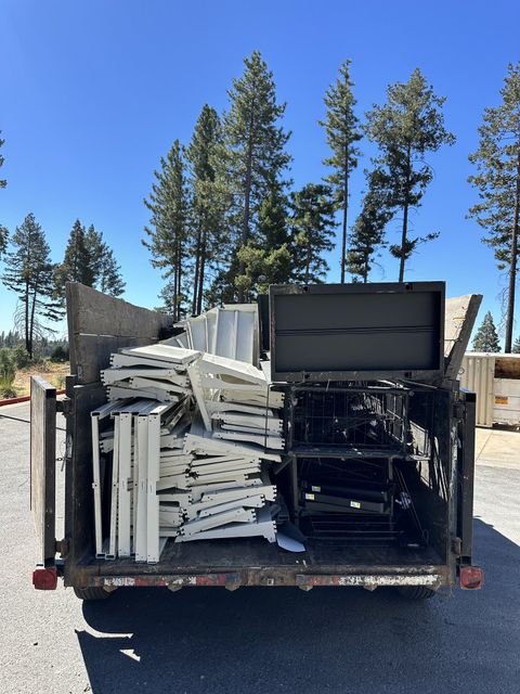 LJ Junk Away trailer fully loaded with junk and debris for haul away