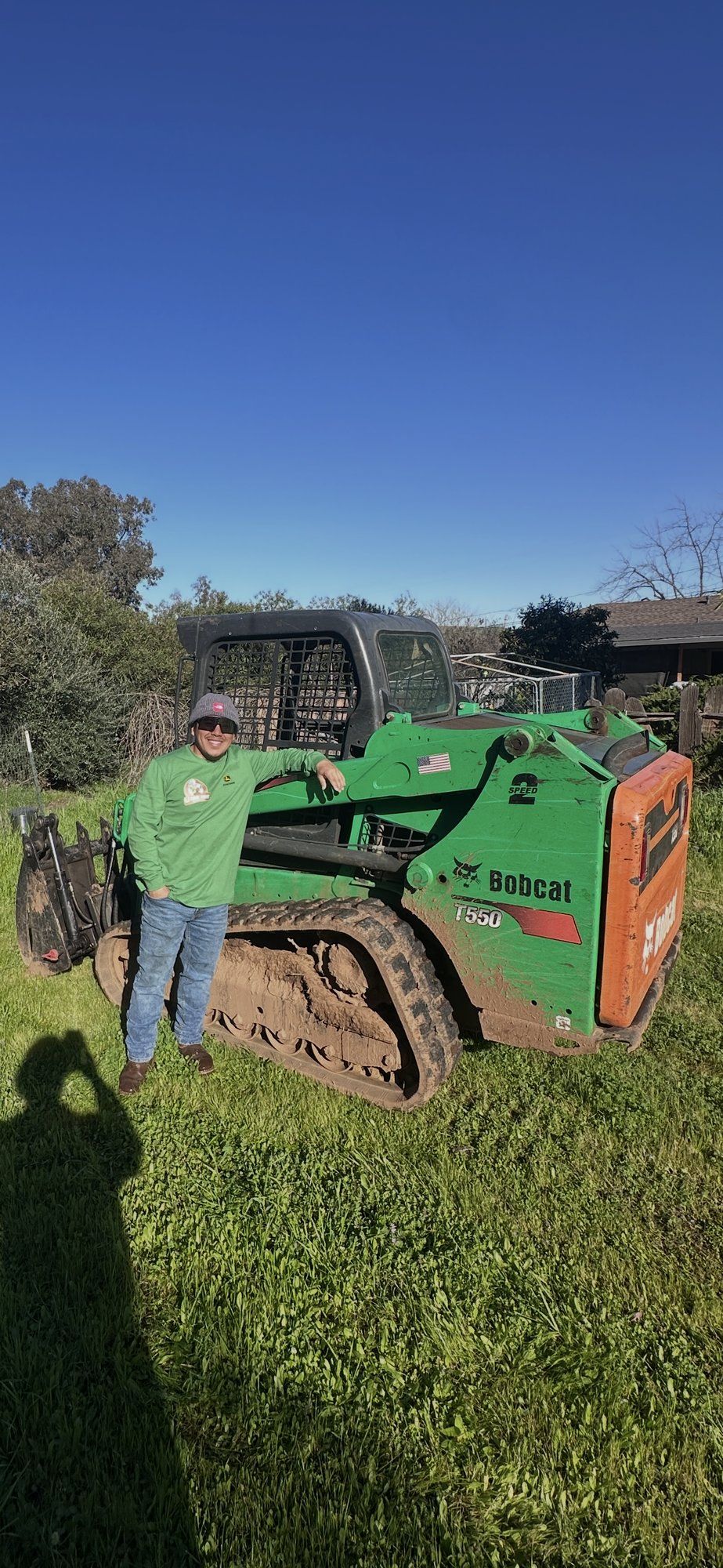 LJ Junk Away owner operating a skid steer for a property cleanout