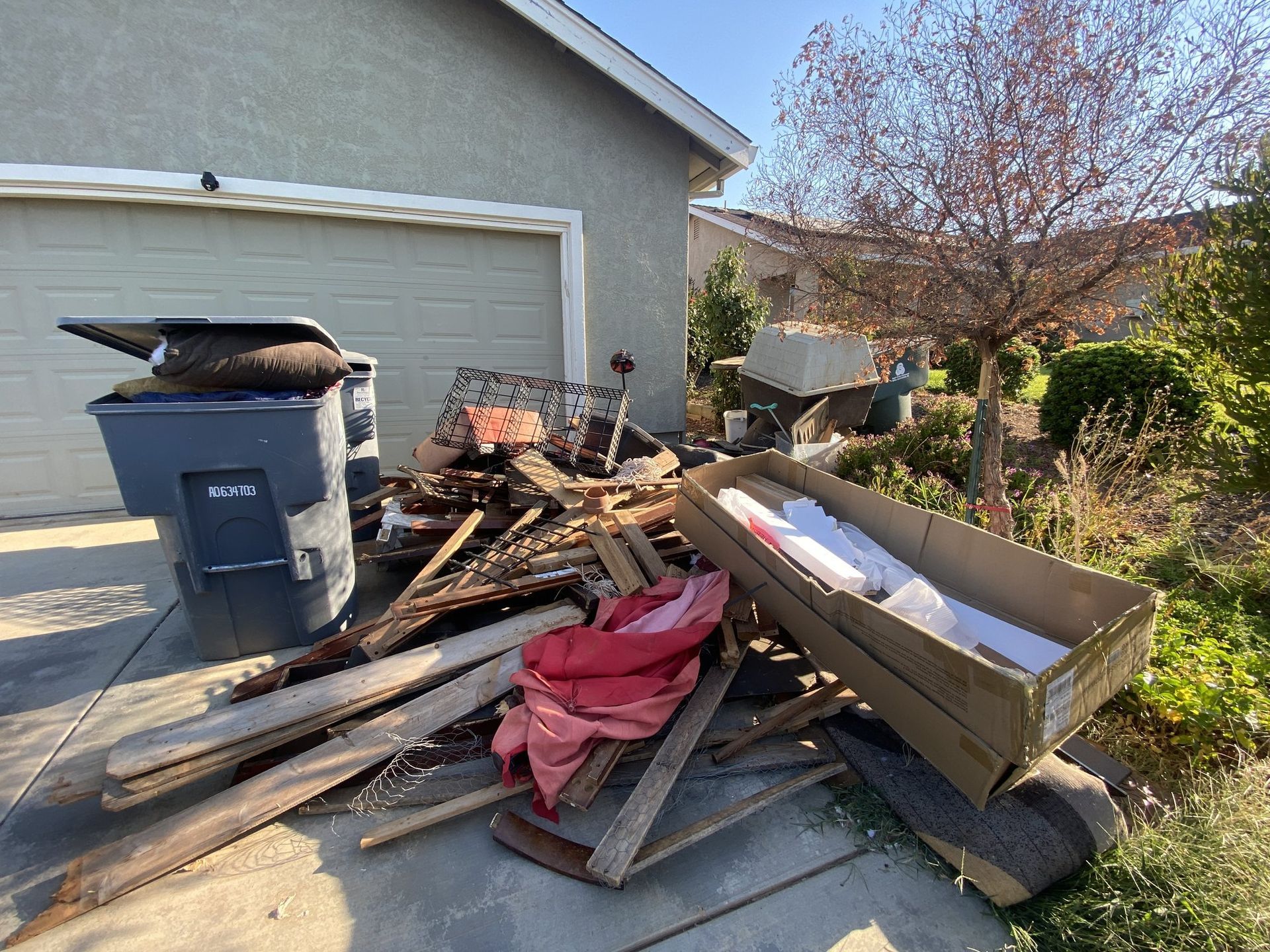 Curbside pile of wood and debris before pickup