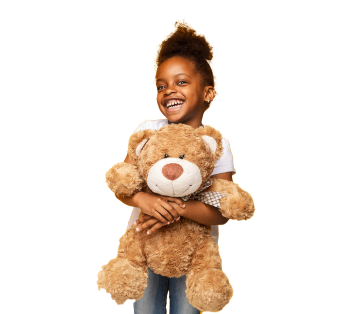 Happy Black girl with curly hair holding a large brown teddy bear, smiling.