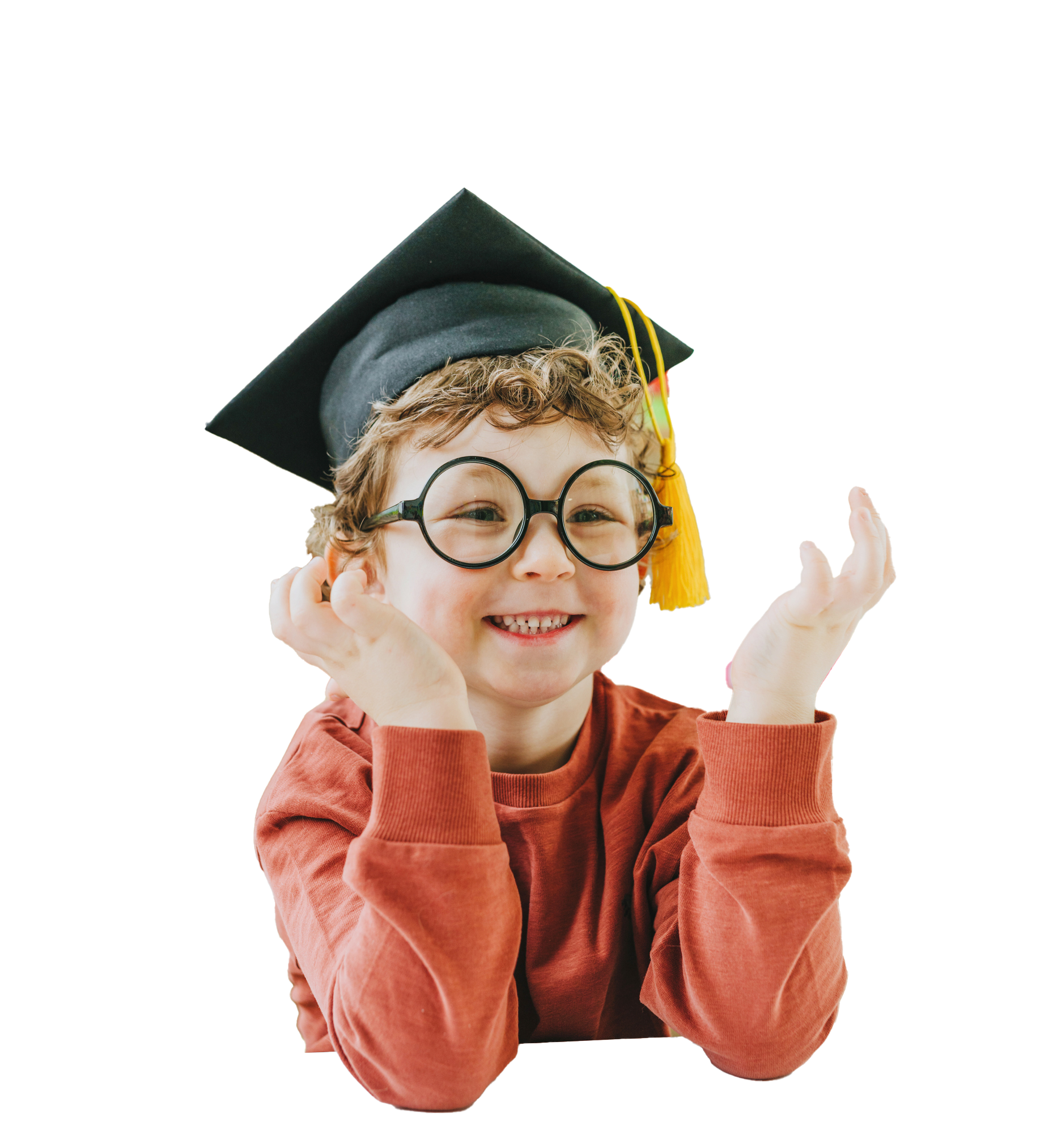 Smiling child with glasses and graduation cap, hands up.