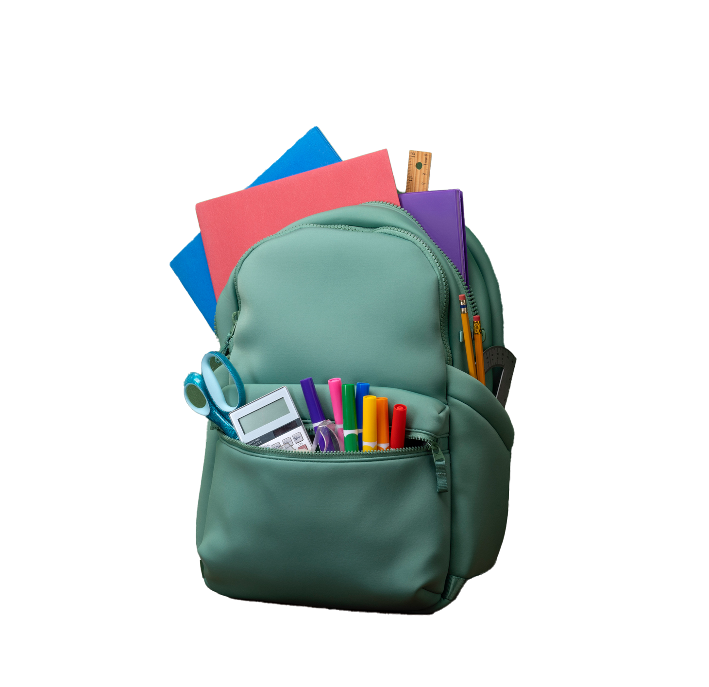 Green backpack filled with school supplies, including folders, pens, and scissors. Green backpack filled with school supplies: folders, markers, calculator, scissors.