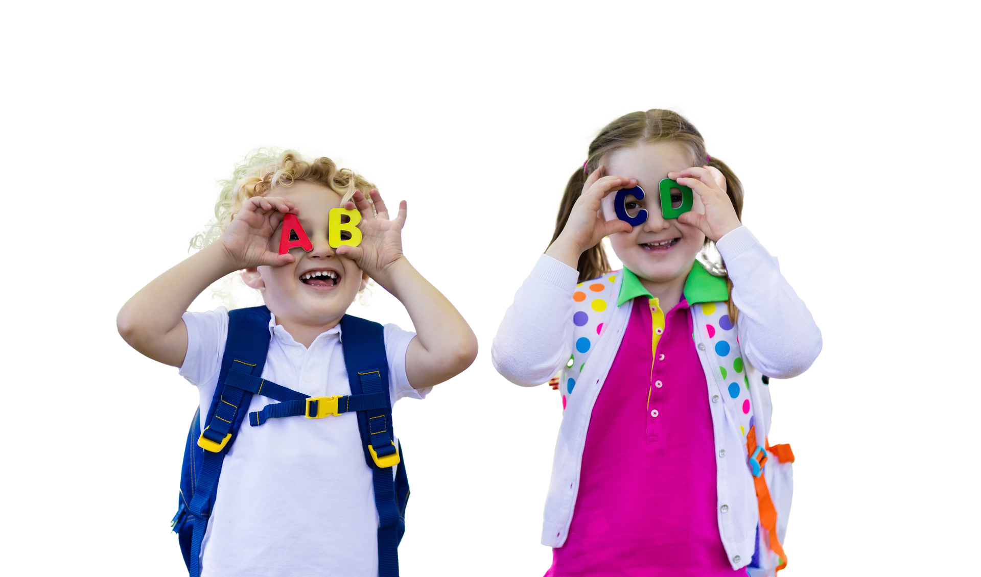Two children holding alphabet letters in front of their eyes, smiling.