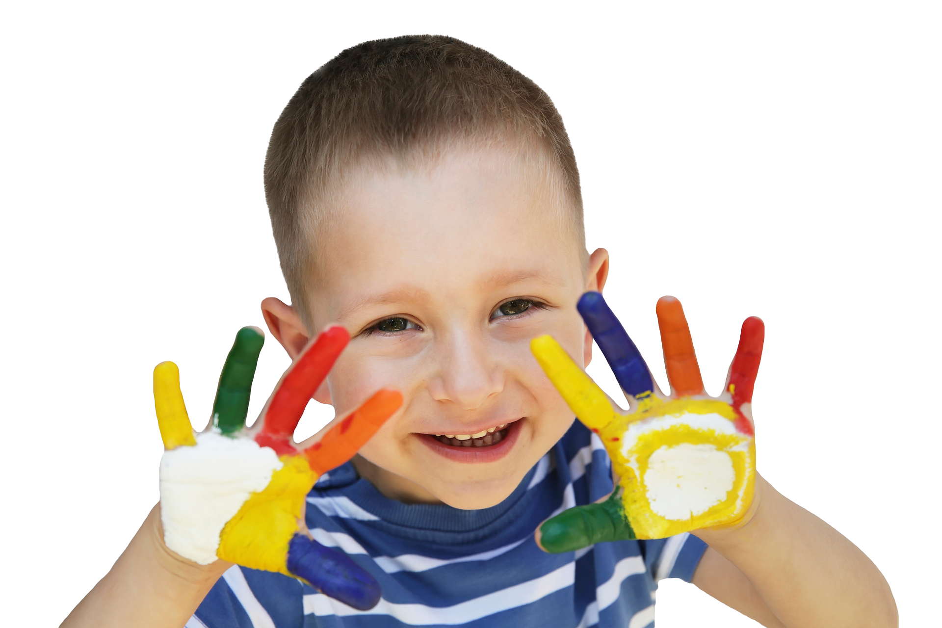 Boy with painted hands smiling, showcasing colorful artwork.