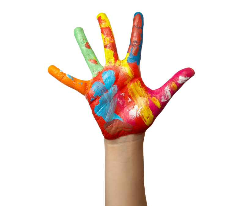 Hand with colorful paint covering palm and fingers. Painted hand with fingers spread, displaying red, orange, yellow, green, and blue paint.