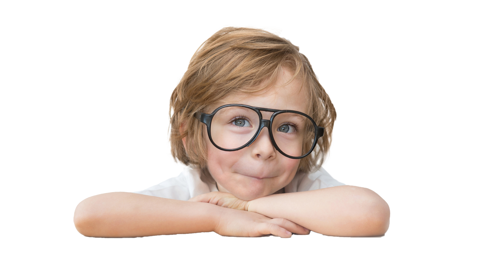 Boy with glasses resting arms on a surface, smiling and looking upward. Boy with glasses smiles, rests chin on arms.