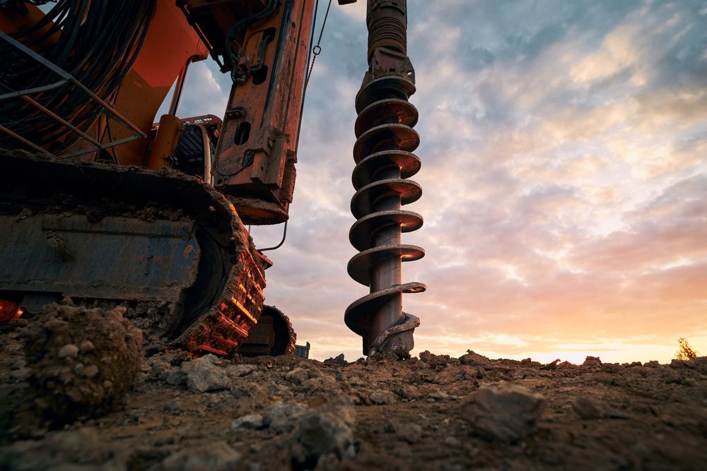 A Bulldozer Is Drilling A Hole In The Ground — Territory Industries Pty Ltd In Katherine, NT