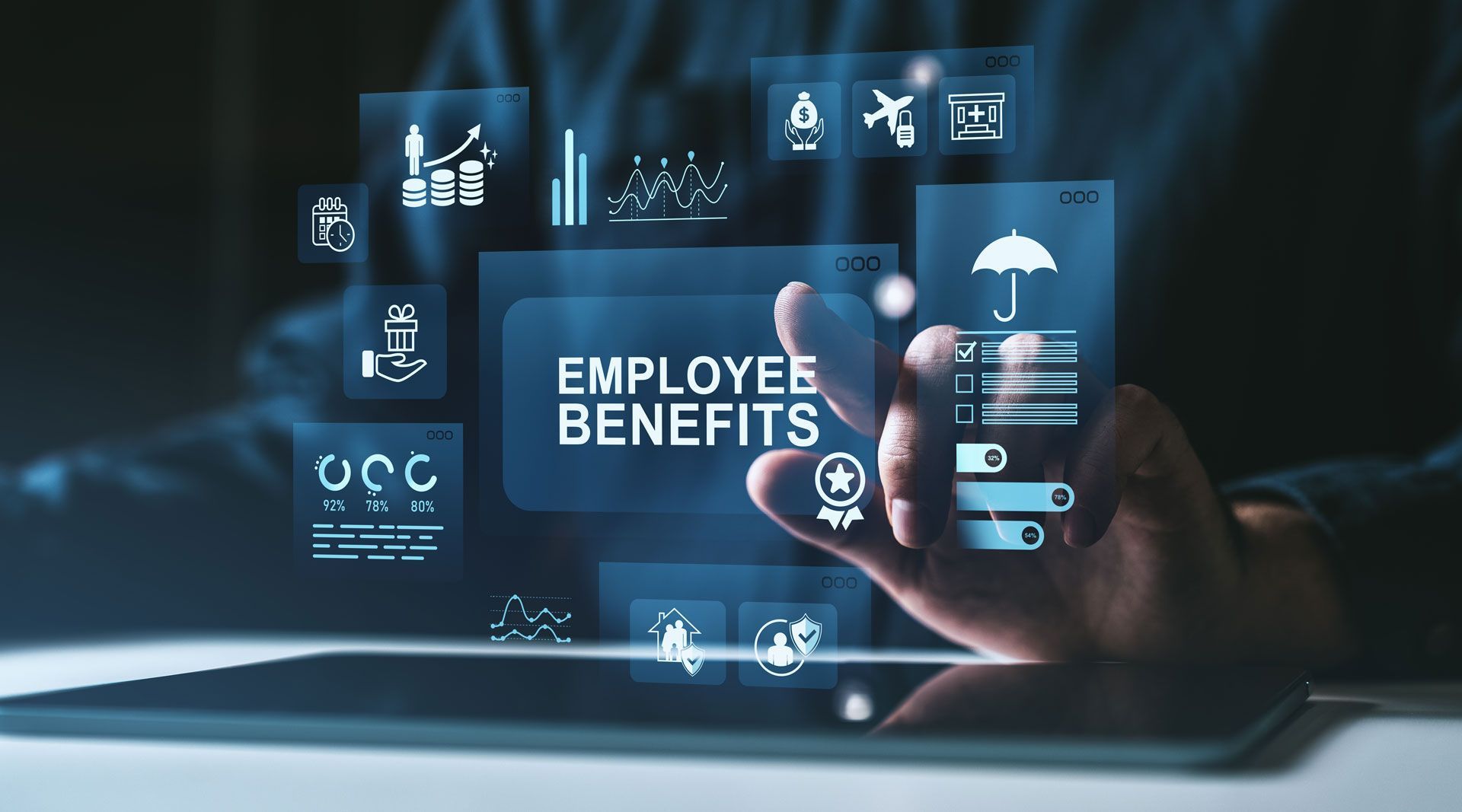 Employee benefits dashboard on a laptop with icons and a hand tapping a holographic screen