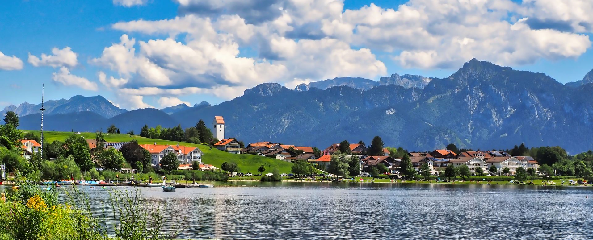 Lake Hopfensee with mountain views in the Eastern Allgäu