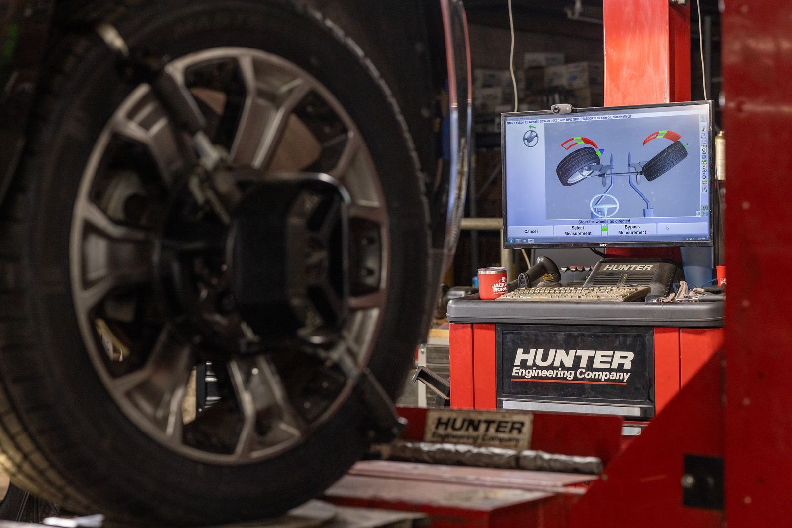 A car is being aligned on a hunter machine.