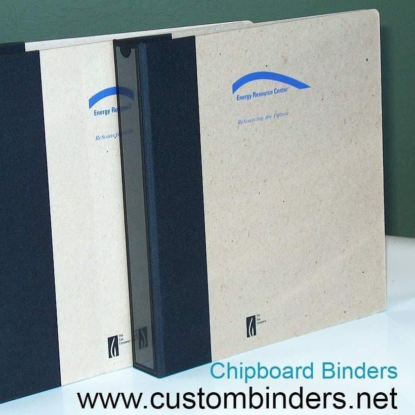 Team using environmentally responsible binders for employee training manuals
