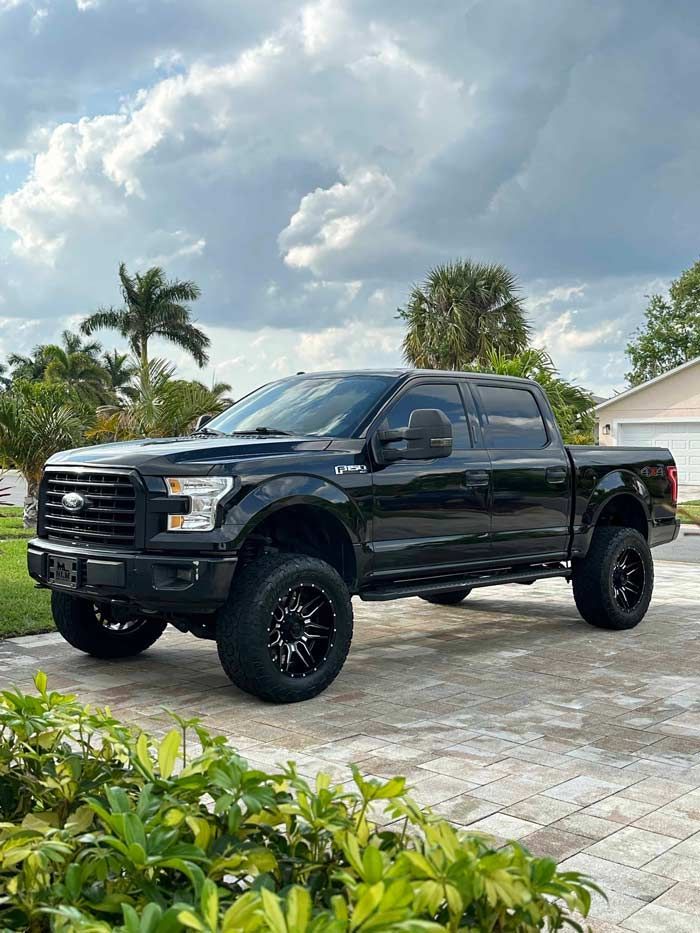 A lifted black Ford F-150 after receiving a full detail in Satellite Beach, FL