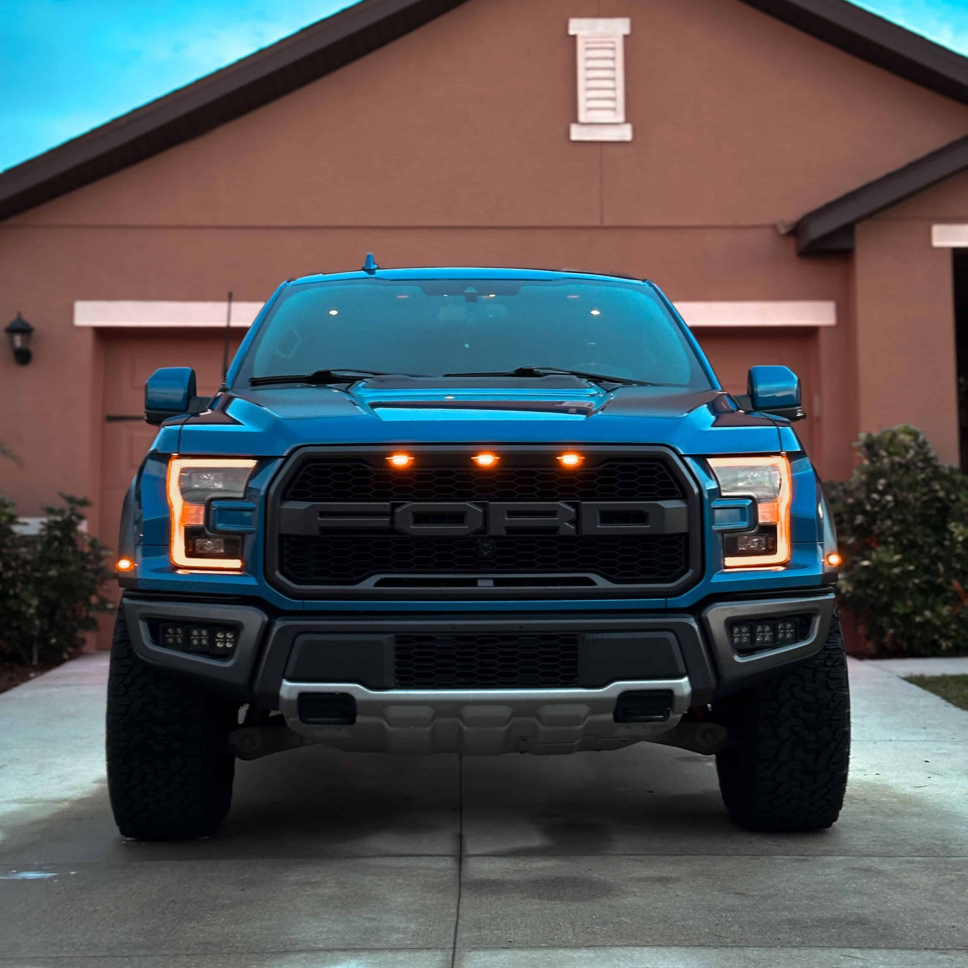A blue Ford Raptor, freshly washed and protected with a ceramic coating in Palm Bay, FL