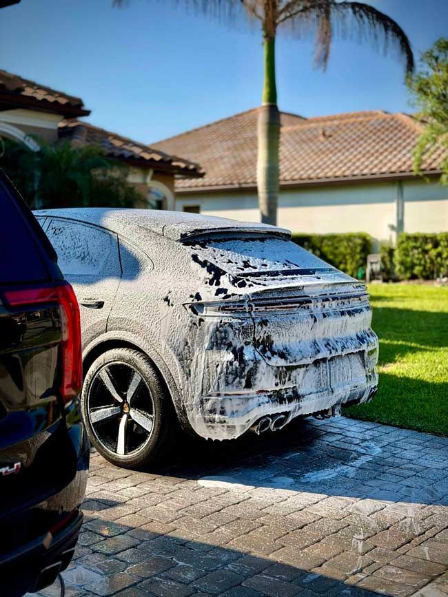 Porsche Cayenne S in foam during an exterior detail in Viera, FL
