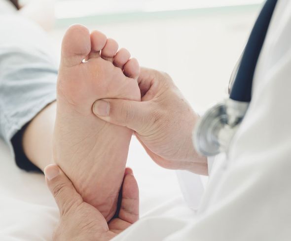 Podiatrist Checking Foot — Indianapolis, IN — Northeast Foot And Ankle