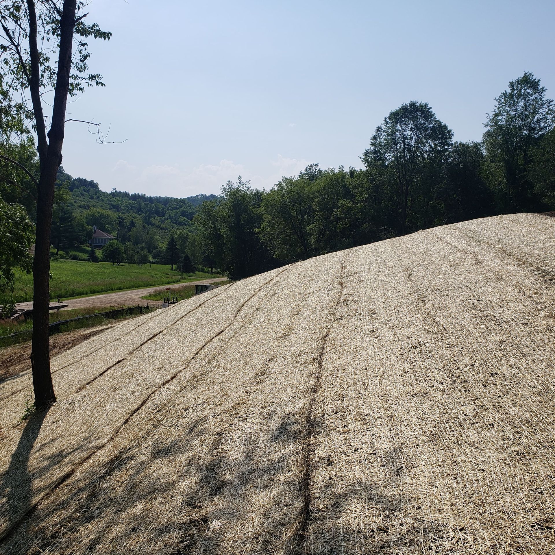 A large pile of gravel is sitting on top of a hill