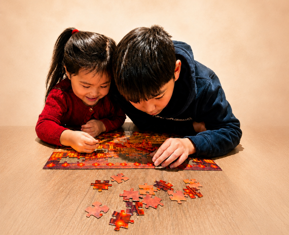two children assembling a culture hop puzzle together