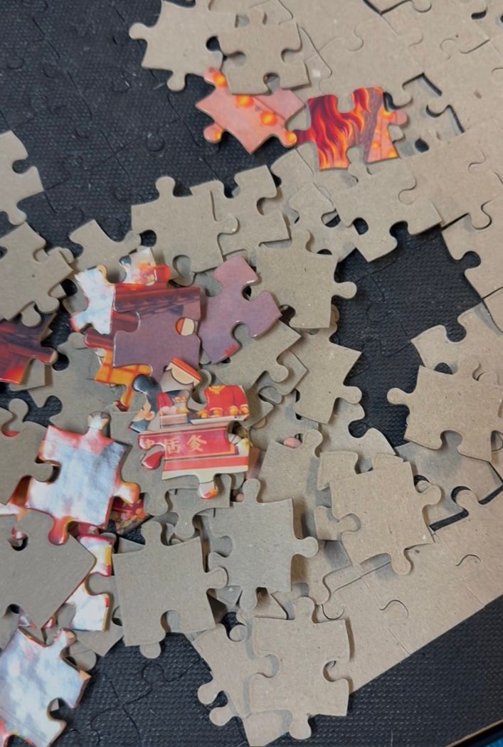 Close-up of Culture Hop puzzle pieces during the assembly and quality-check process