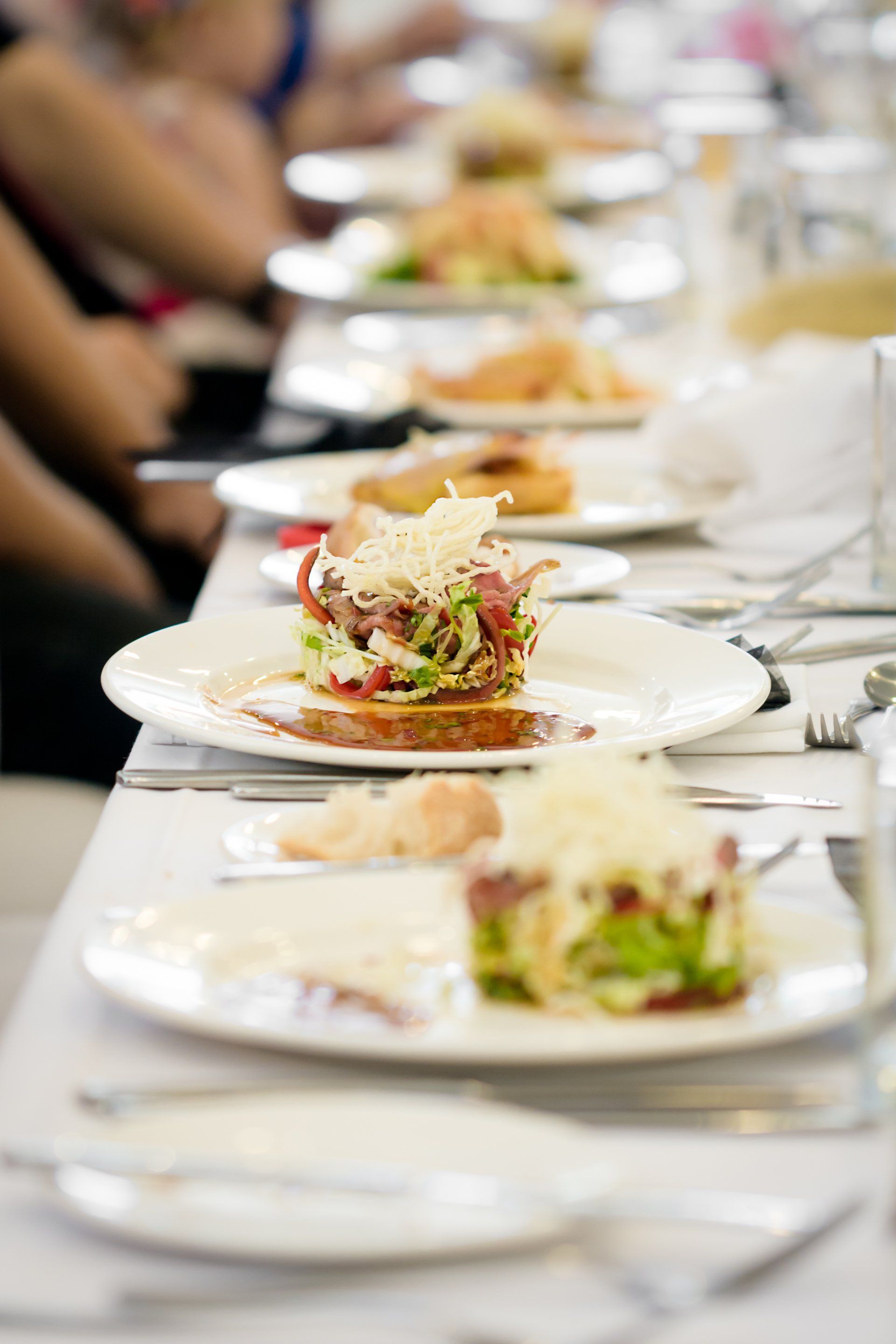 A long table with plates of food on it