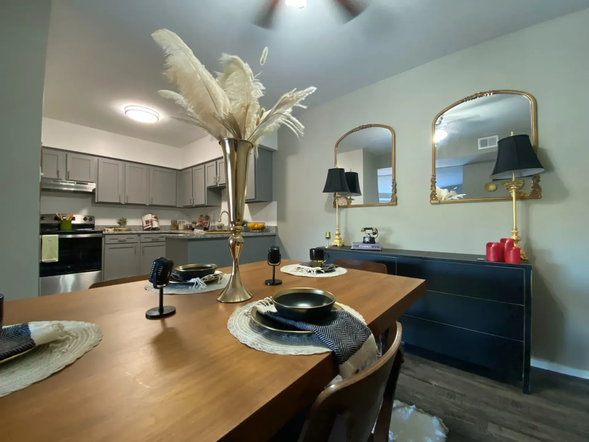Stylish dining area with a kitchen in the background