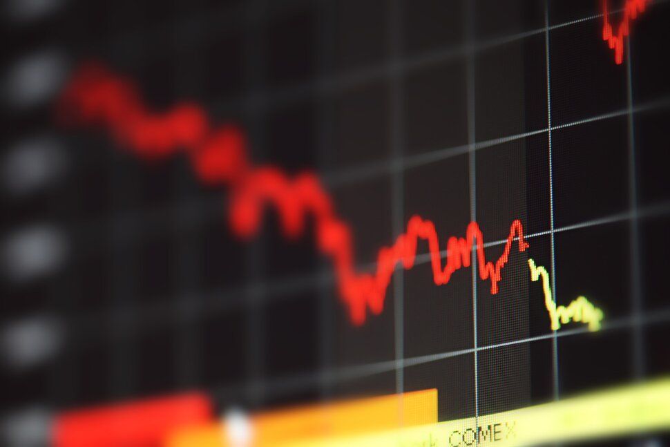 A close up of a graph showing a red line going down