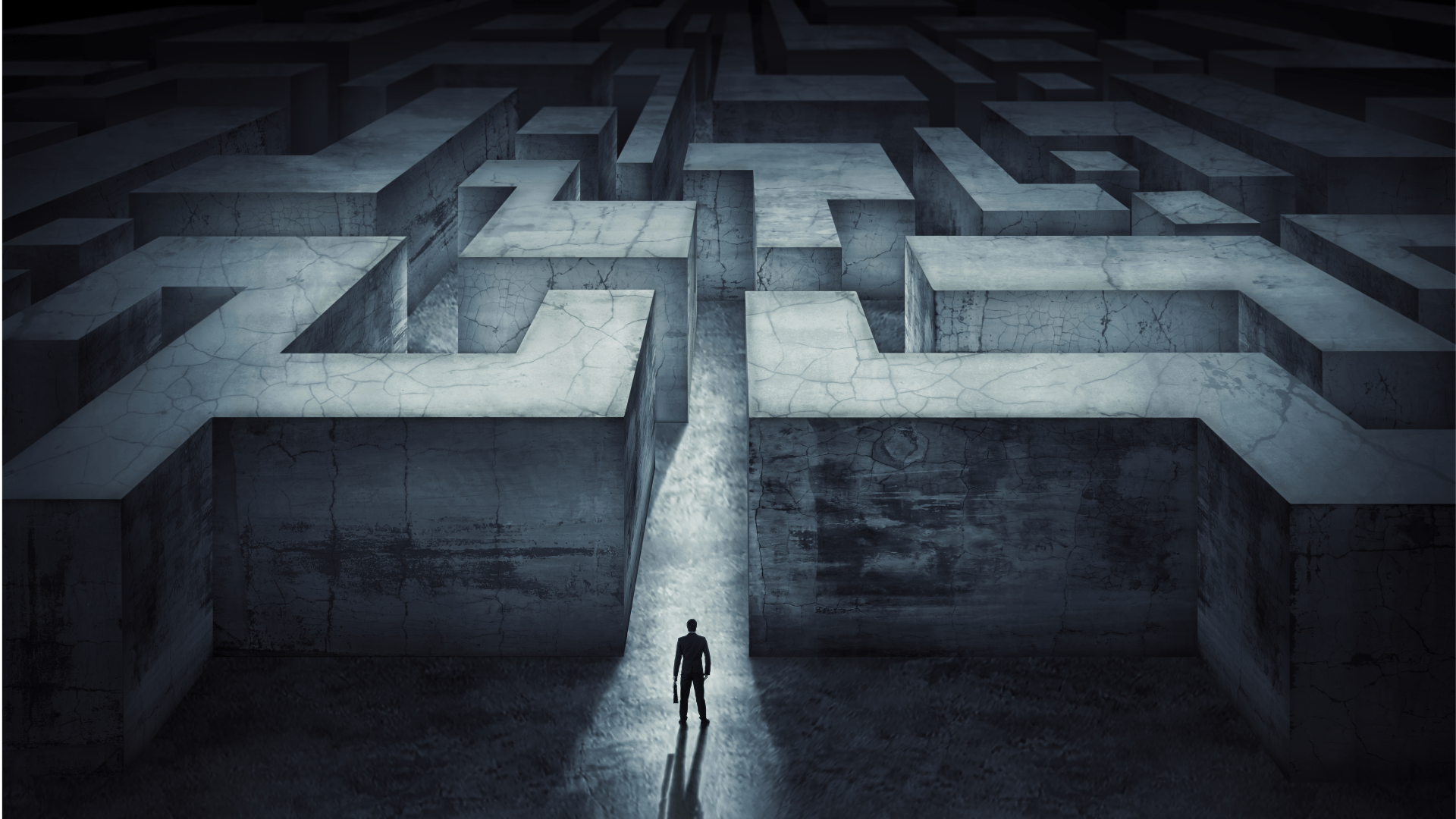 A man is standing in the middle of a maze.