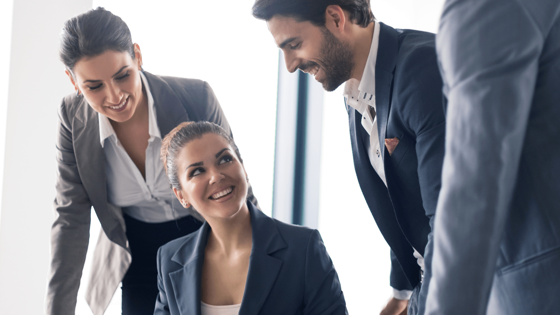 A group of business people are having a meeting in an office.