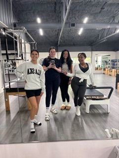 New client in her first BE Pilates class receiving personalized instruction in Burleson, Fort Worth