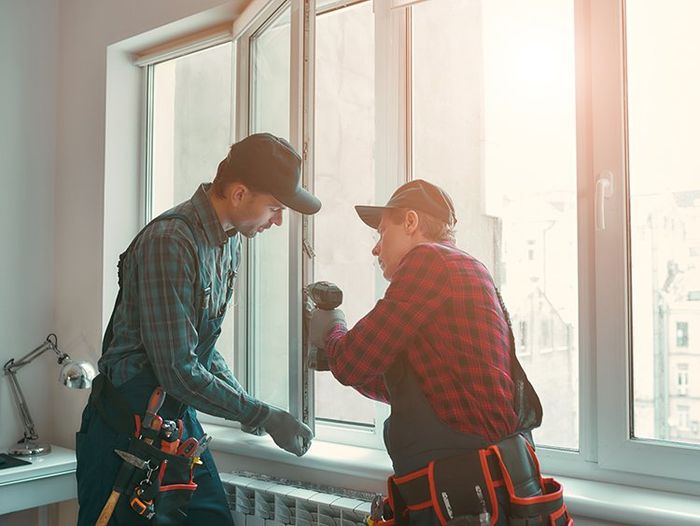 Men are Installing the Window — Groves, TX, — Alamo Glass of Port Arthur Inc