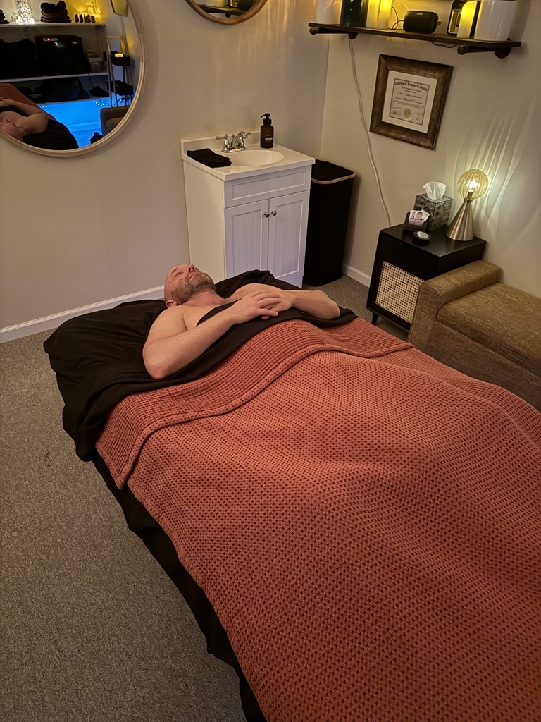 Three black stones on a wooden surface labeled Body, Soul, and Relax Three black stones on a wooden surface labeled Body, Soul, and Relax