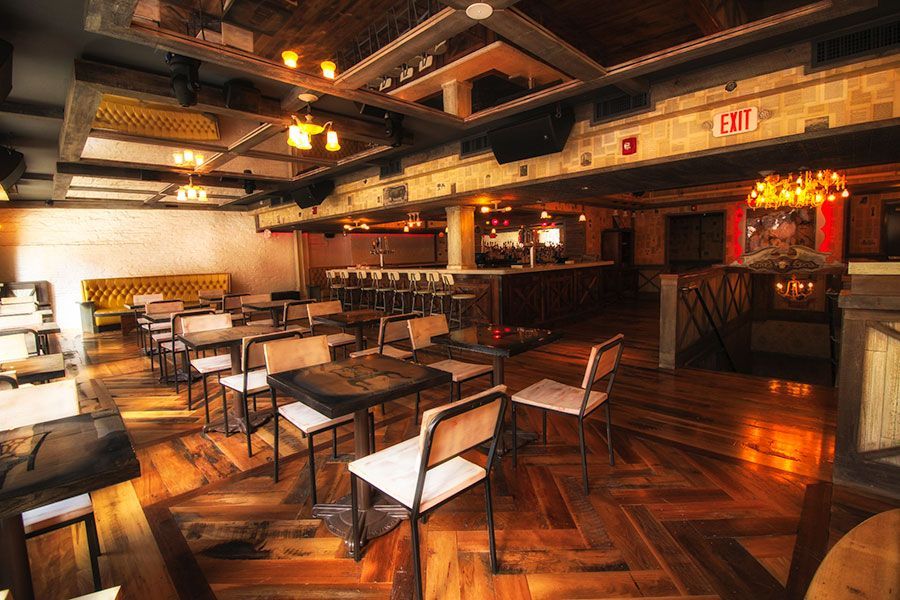Private event space with tables and seating at White Bull Tavern in Boston