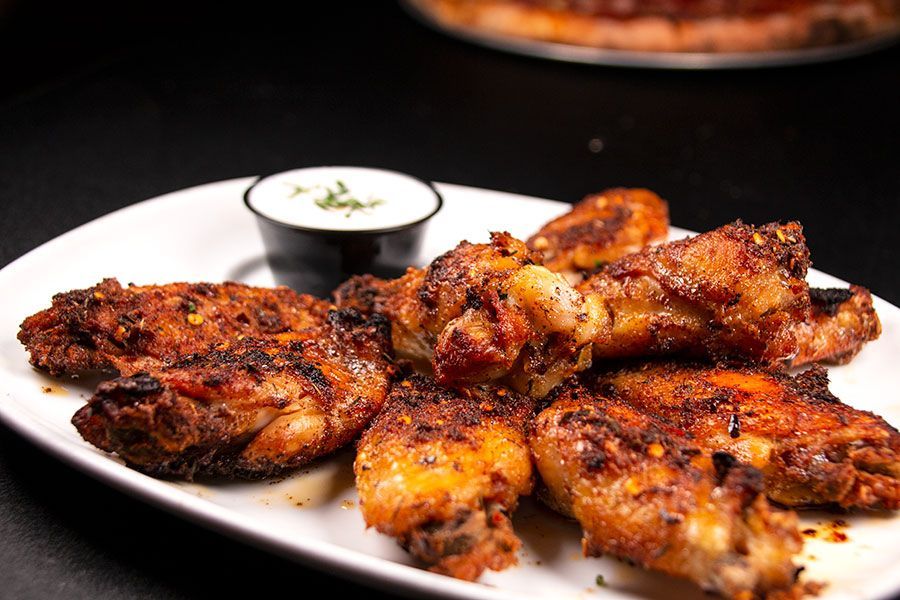 Crispy wings with flavorful sauces perfect for takeout nights.