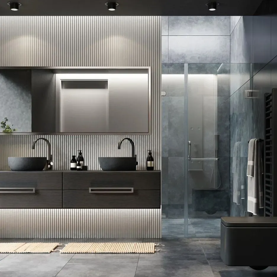 Modern bathroom with dark gray vanity, black sinks, large mirror, and glass shower.