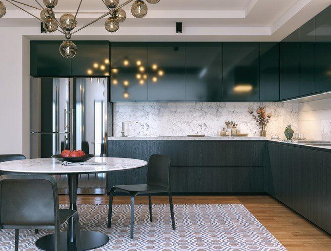 Modern kitchen with dark cabinetry, marble counters, round table, chairs, and patterned floor.
