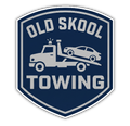 Old Skool Towing logo with white tow truck and car on dark blue shield
