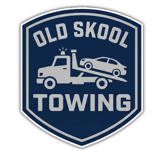 Old Skool Towing logo with white tow truck and car on dark blue shield