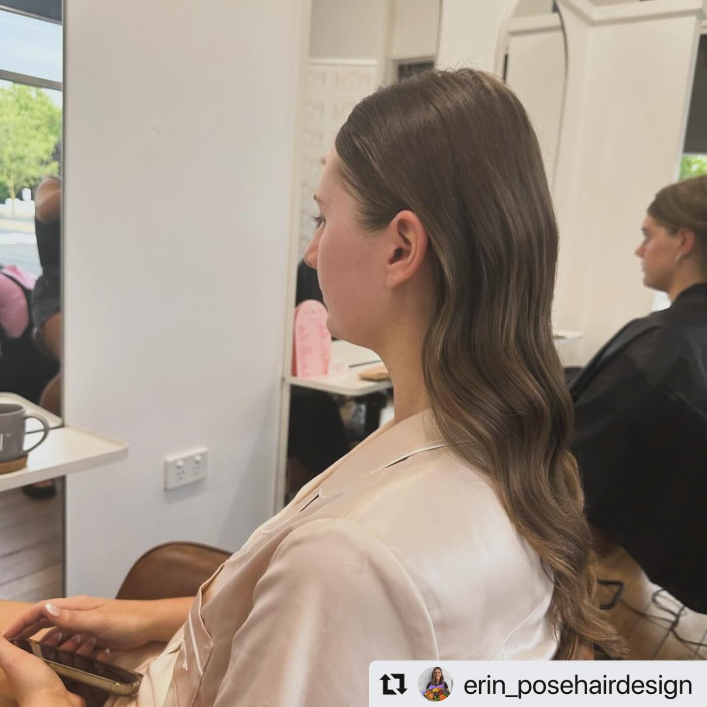 Side-Profile Salon Portrait of A Person with Long Wavy Brown Hair in A White Top — Pose Hair Design in Orange, NSW