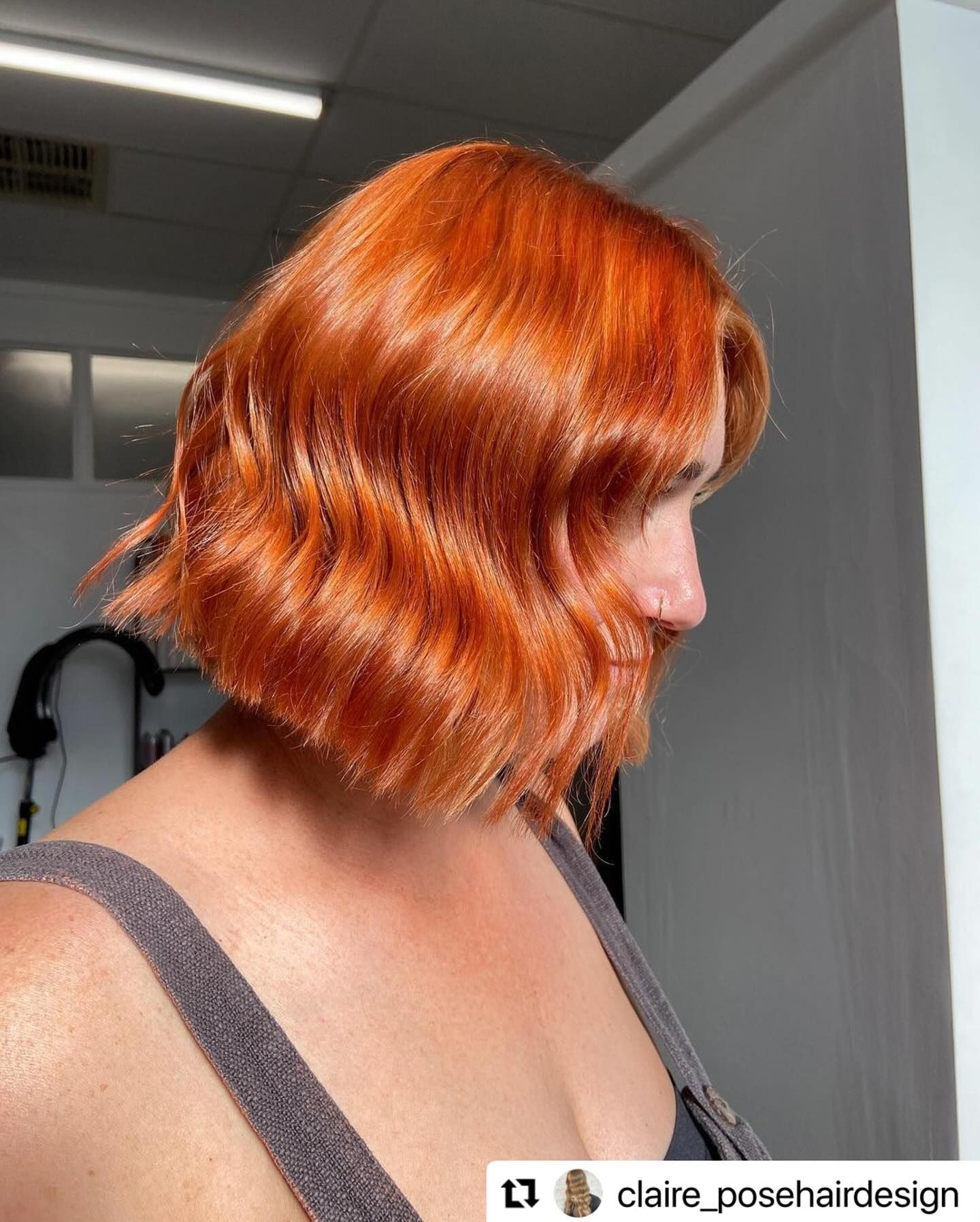 Hair colour being applied to a seated client in a salon, with foil highlights under a stylist’s hands — Pose Hair Design in Orange, NSW