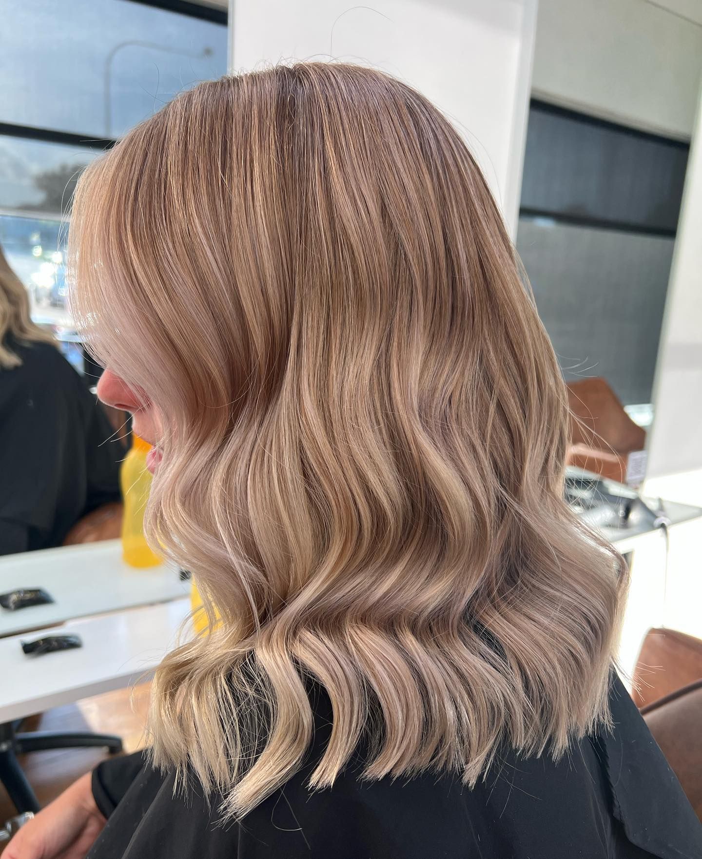 Wavy Shoulder-Length Blonde Bob with Soft Layers in A Salon Chair, Shown from The Side — Pose Hair Design in Orange, NSW