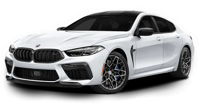 White BMW M8 Gran Coupe with black accents and wheels.